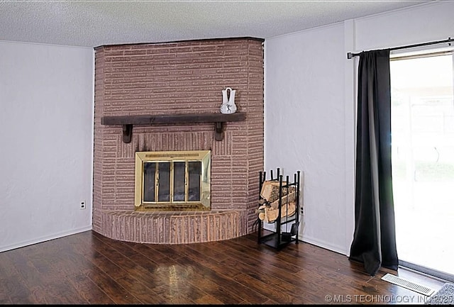 1112 N Hickory Ct, Broken Arrow, OK 74012 - unfurnished living room with a brick fireplace, wood finished floors, and a textured ceiling