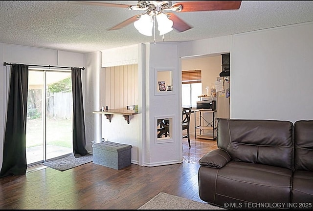 1112 N Hickory Ct, Broken Arrow, OK 74012 - living area featuring a ceiling fan, wood finished floors, and a textured ceiling