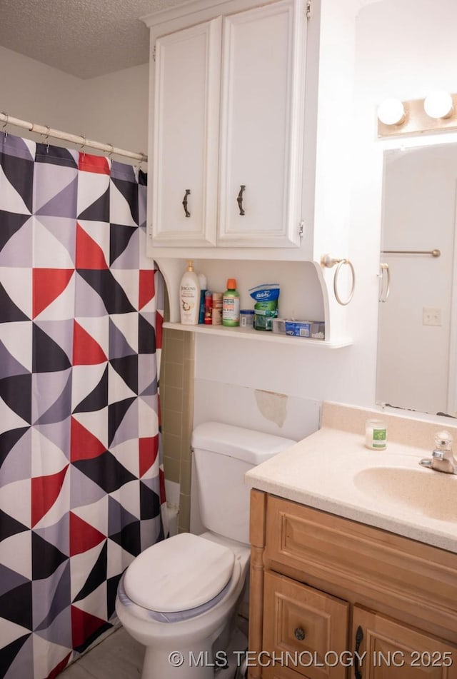 1112 N Hickory Ct, Broken Arrow, OK 74012 - bathroom with vanity, toilet, a textured ceiling, and a shower with curtain