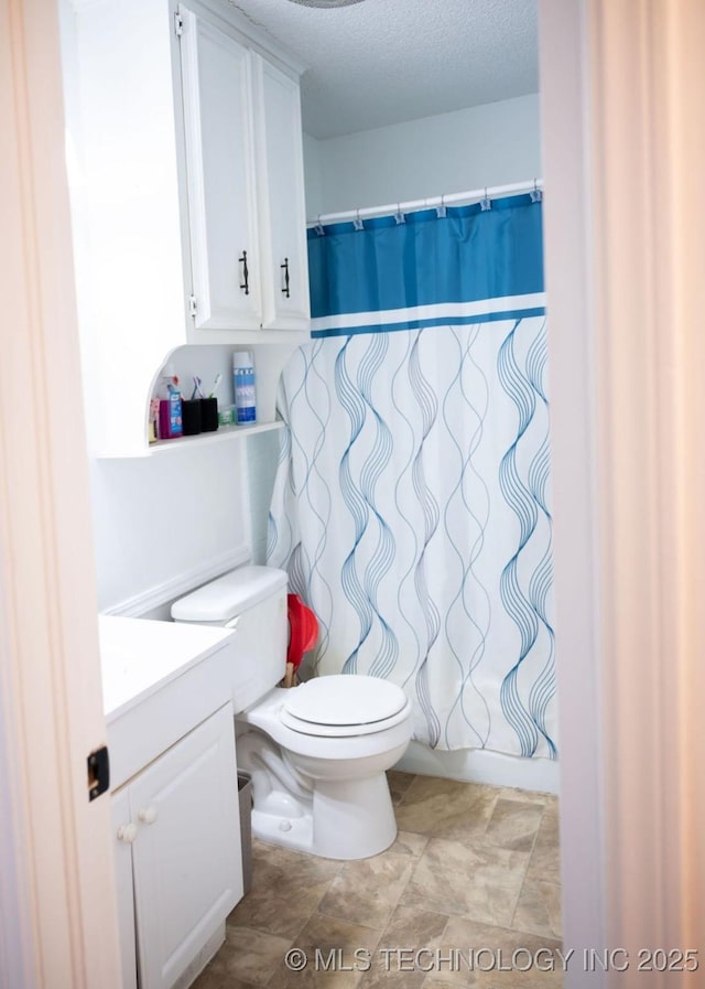 1112 N Hickory Ct, Broken Arrow, OK 74012 - full bathroom with vanity, toilet, a textured ceiling, and a shower with shower curtain