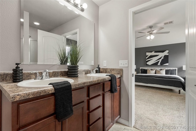 full bath featuring ceiling fan, visible vents, a sink, and ensuite bathroom