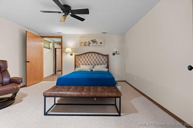 carpeted bedroom with baseboards, ceiling fan, and visible vents