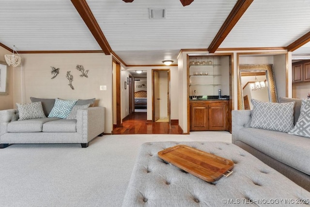living area with crown molding, bar area, carpet flooring, and visible vents