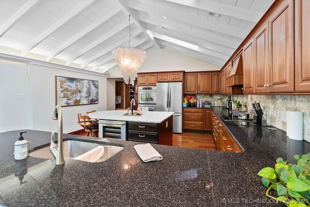 kitchen featuring a sink, premium range hood, freestanding refrigerator, wine cooler, and vaulted ceiling with beams
