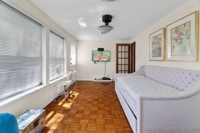 living area featuring baseboards