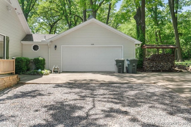 garage with concrete driveway