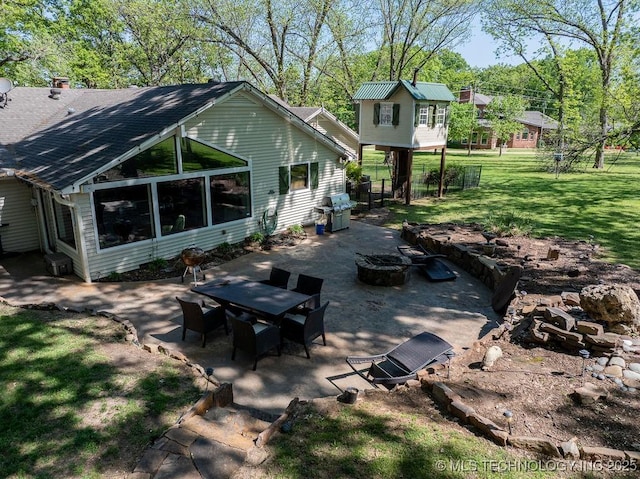 view of patio / terrace featuring outdoor dining space, a fire pit, and area for grilling