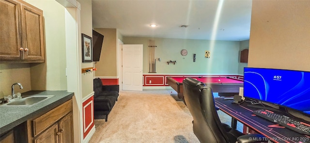 game room with light colored carpet and a sink