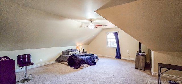 bedroom featuring carpet floors, a ceiling fan, baseboards, and lofted ceiling