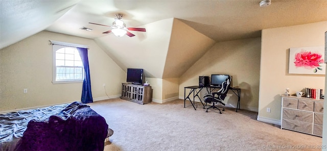 carpeted bedroom with a ceiling fan, vaulted ceiling, and visible vents