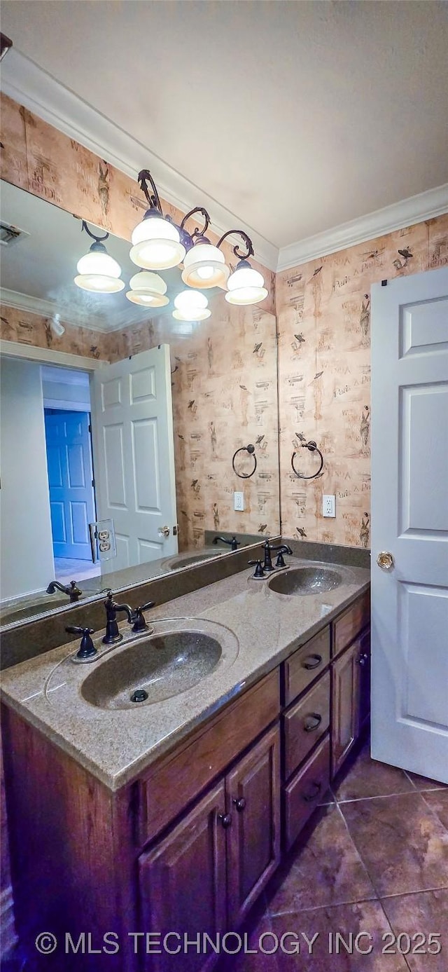 bathroom featuring double vanity, a sink, visible vents, and ornamental molding