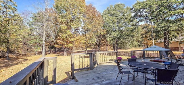 wooden deck with outdoor dining area