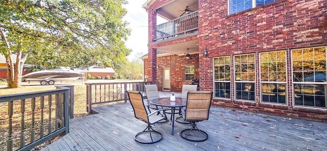 wooden deck with outdoor dining area