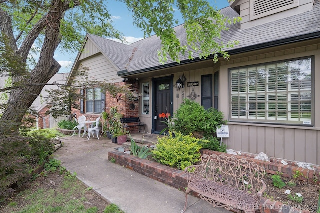 view of front of house featuring roof with shingles
