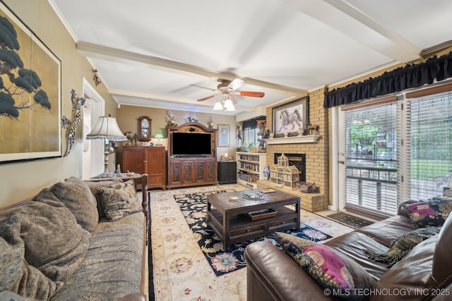 living area with ornamental molding, a brick fireplace, ceiling fan, and beam ceiling