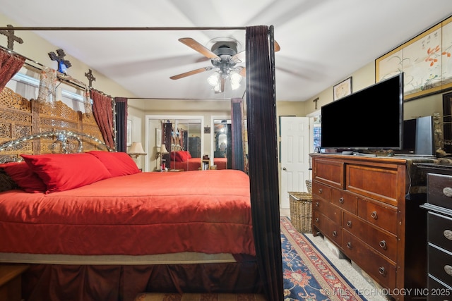 bedroom featuring a ceiling fan and multiple windows