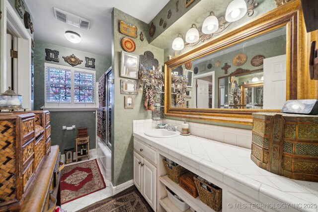 full bathroom featuring visible vents, tile patterned flooring, and vanity