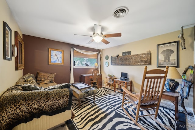 interior space featuring a ceiling fan and visible vents