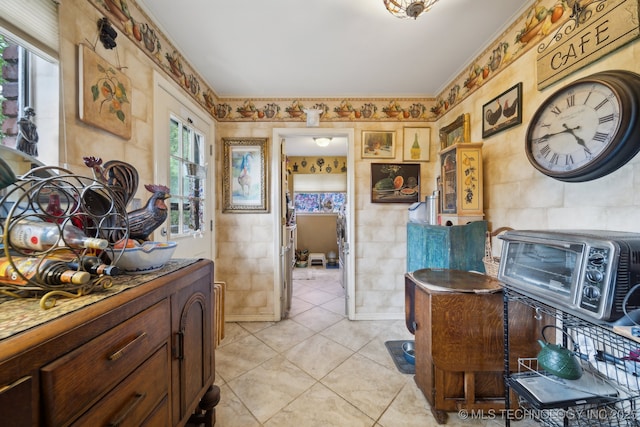 bathroom with tile walls and tile patterned flooring
