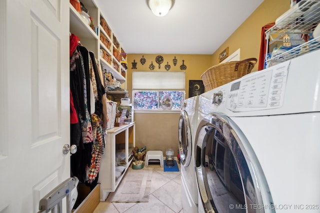 washroom with laundry area and washing machine and dryer