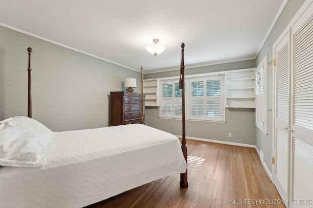 3428 S Birmingham Ave, Tulsa, OK 74105 - bedroom with baseboards, multiple windows, wood finished floors, and ornamental molding