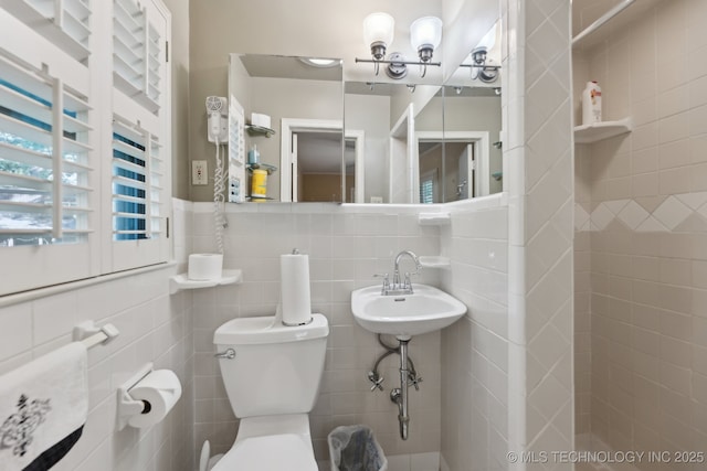 3428 S Birmingham Ave, Tulsa, OK 74105 - half bath with tile walls, toilet, and a chandelier