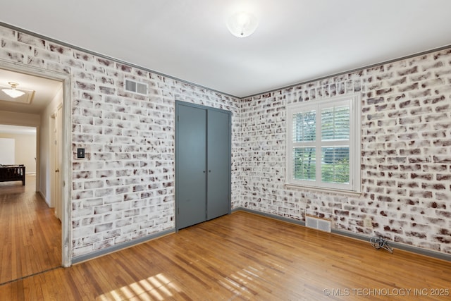3428 S Birmingham Ave, Tulsa, OK 74105 - unfurnished room featuring visible vents, baseboards, and hardwood / wood-style floors