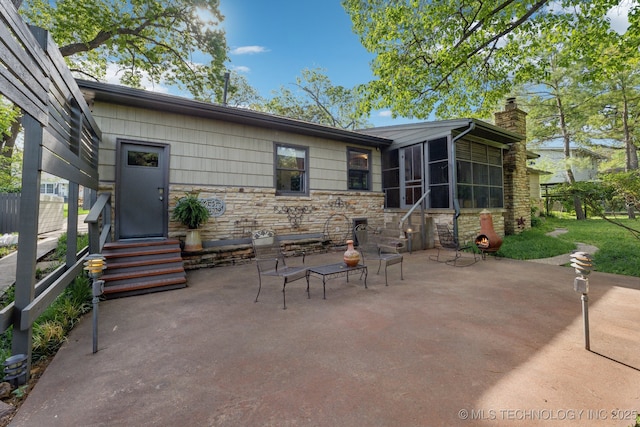 3428 S Birmingham Ave, Tulsa, OK 74105 - view of patio featuring a sunroom and entry steps