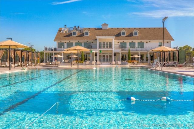 pool featuring a patio, fence, and a gazebo