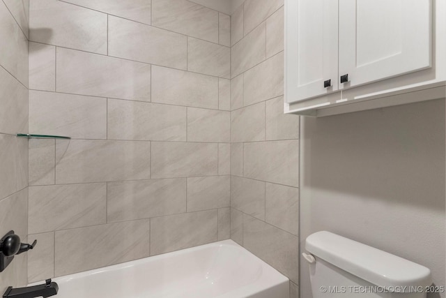 bathroom featuring toilet and bathtub / shower combination