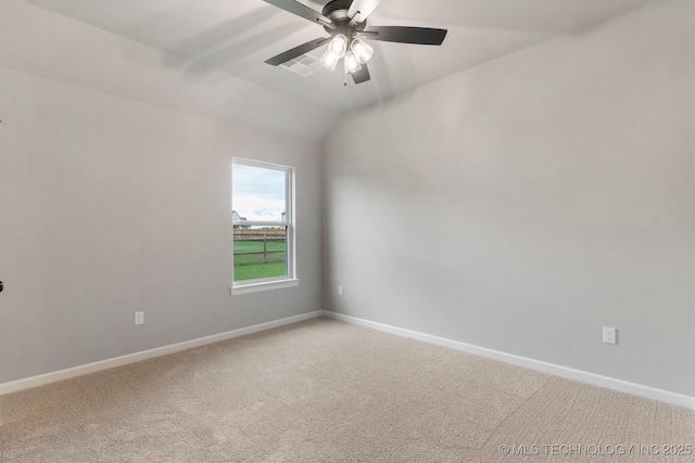 empty room featuring a ceiling fan, baseboards, and light colored carpet