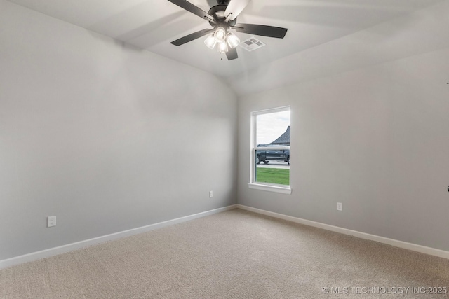 spare room featuring a ceiling fan, baseboards, visible vents, and light carpet