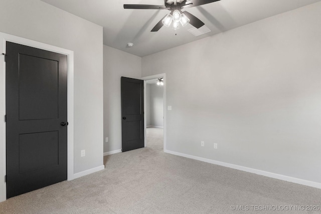 unfurnished bedroom with baseboards, ceiling fan, and light colored carpet
