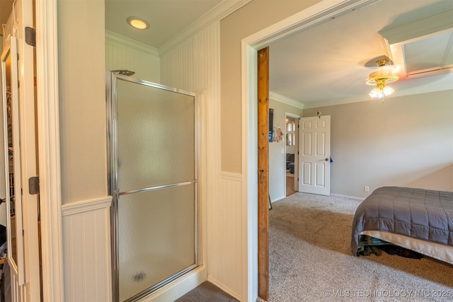 full bath featuring crown molding and a stall shower