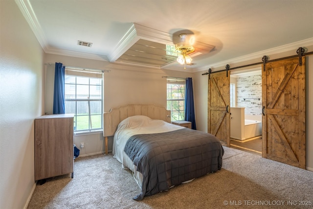 carpeted bedroom featuring visible vents, a barn door, baseboards, and ornamental molding