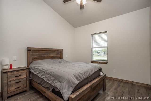 bedroom with baseboards, ceiling fan, vaulted ceiling, and wood finished floors