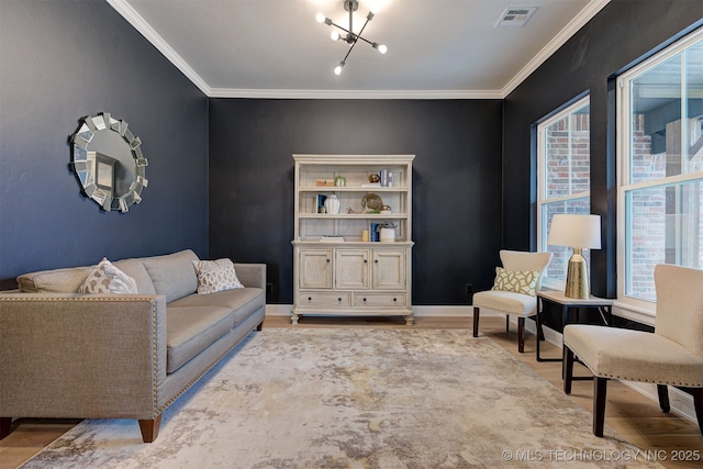 sitting room with baseboards, visible vents, ornamental molding, and wood finished floors