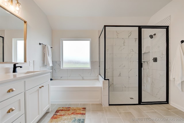 bathroom with vanity, a stall shower, and a bath