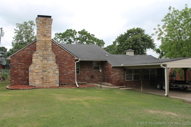 back of house featuring brick siding, a shingled roof, a yard, and a chimney