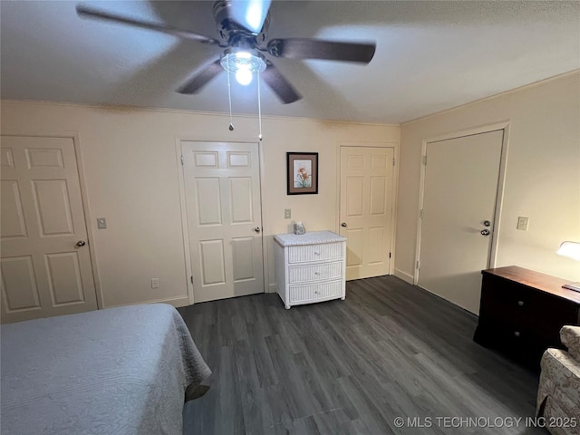 1029 N Kenwood Ave, Broken Arrow, OK 74012 - bedroom featuring ceiling fan and dark wood-style floors