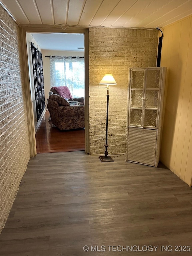 1029 N Kenwood Ave, Broken Arrow, OK 74012 - corridor with brick wall and wood finished floors