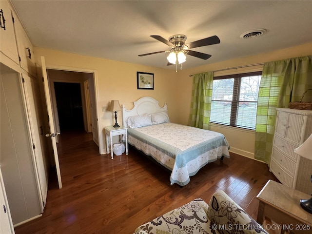 1029 N Kenwood Ave, Broken Arrow, OK 74012 - bedroom with baseboards, a ceiling fan, dark wood-style floors, and visible vents