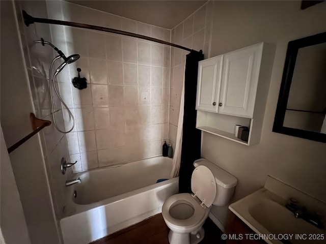 full bath featuring vanity, toilet, and shower / tub combo with curtain
