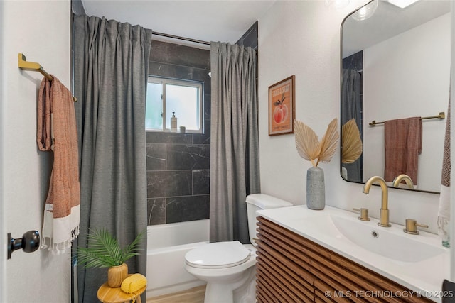 bathroom with vanity, shower / bath combo, and toilet