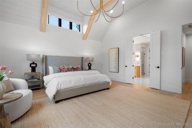 bedroom featuring high vaulted ceiling, a notable chandelier, baseboards, and wood finished floors