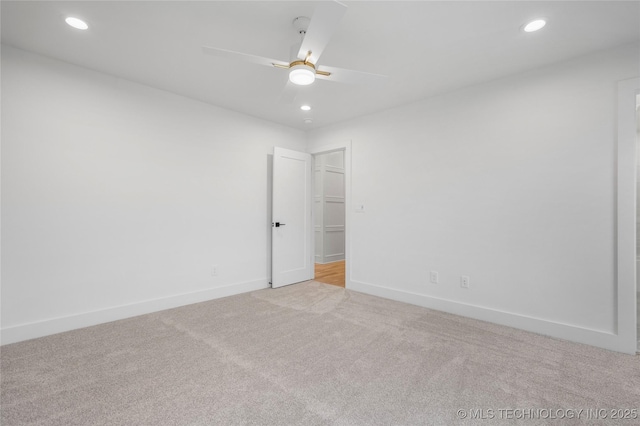 spare room with recessed lighting, baseboards, ceiling fan, and light carpet