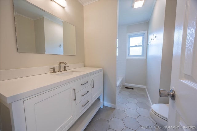 bathroom featuring vanity, tile patterned flooring, visible vents, toilet, and baseboards