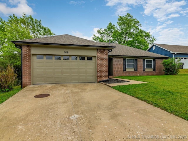 ranch-style house featuring a shingled roof, an attached garage, a front lawn, brick siding, and driveway