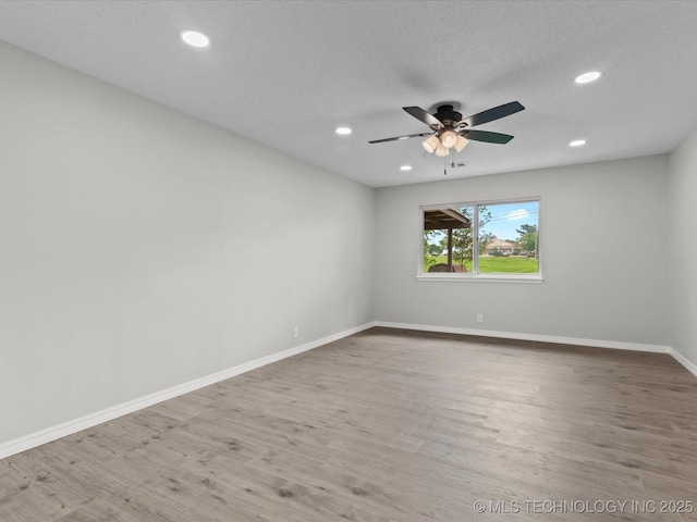 unfurnished room featuring recessed lighting, baseboards, ceiling fan, and wood finished floors