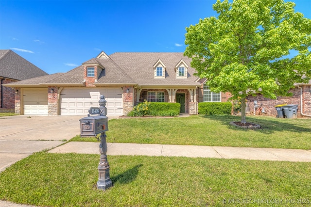 view of front of property featuring a garage, concrete driveway, a front lawn, and stone siding